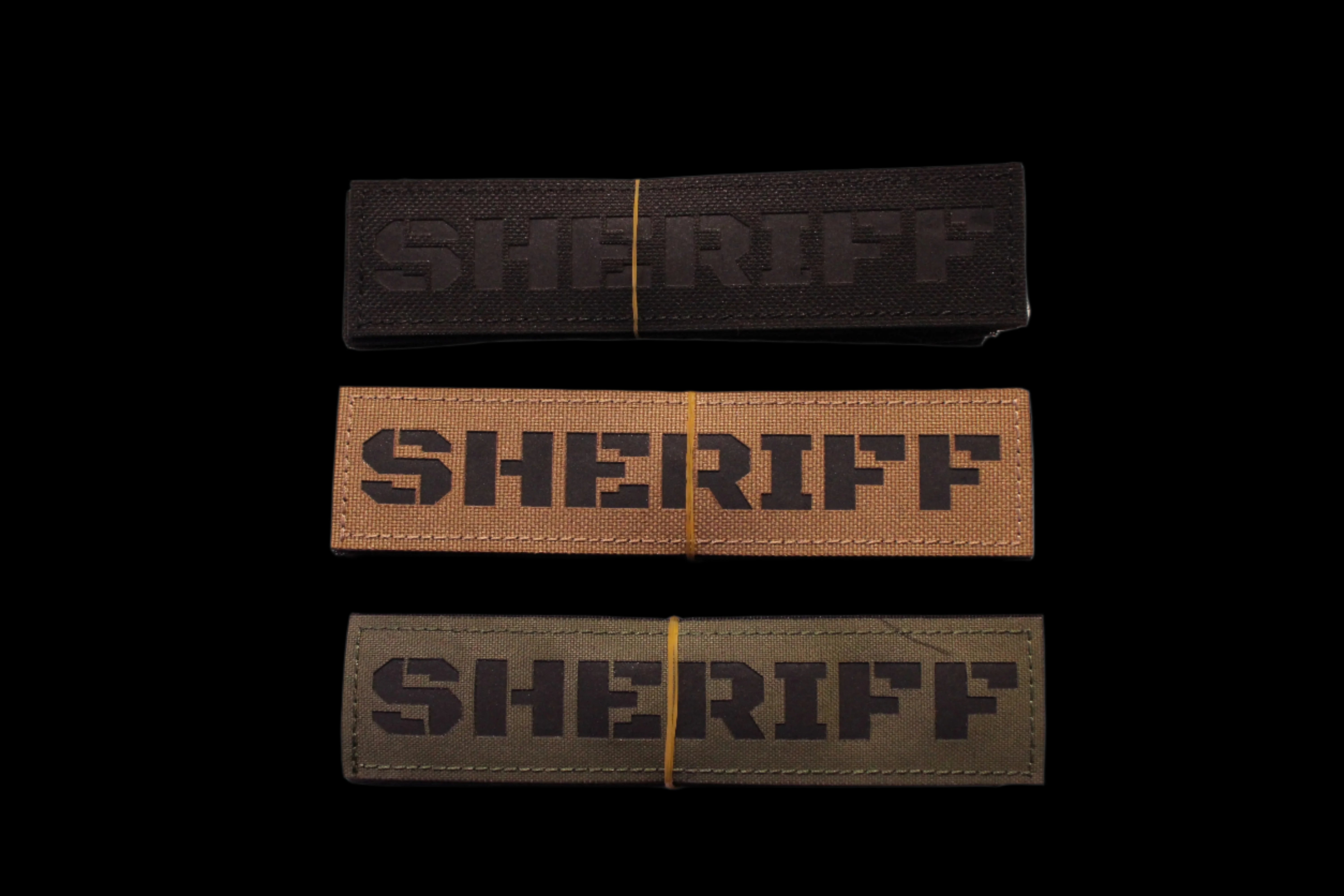 Three 'SHERIFF' Patches in Black, Coyote brown, and Olive Drab green