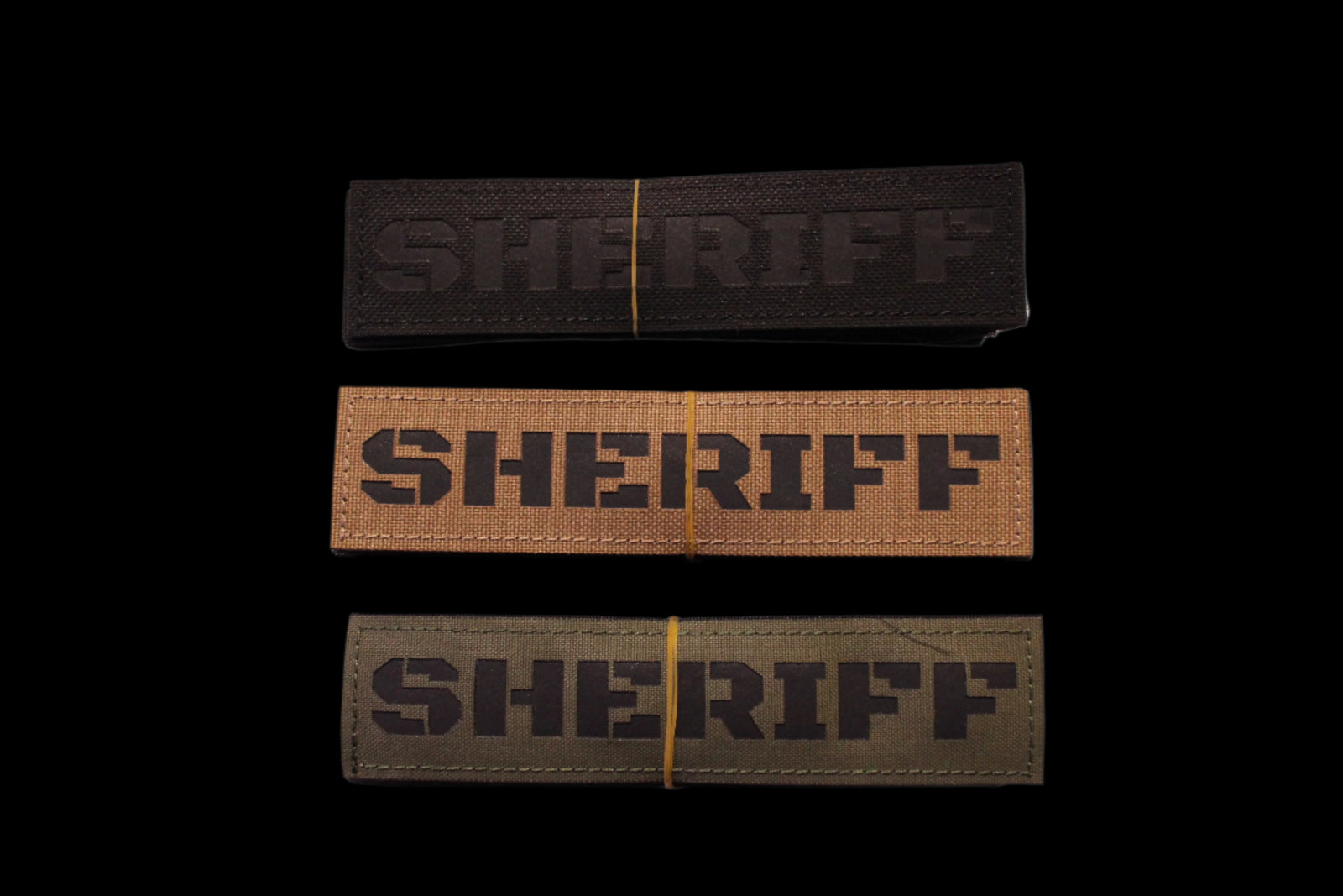 Three 'SHERIFF' Patches in Black, Coyote brown, and Olive Drab green